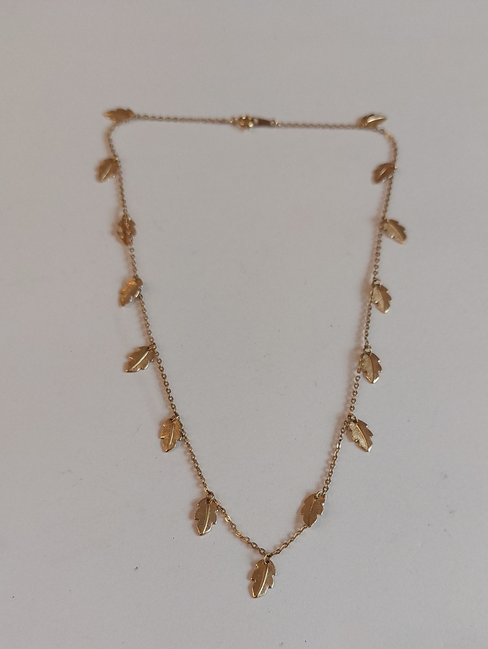 1983 Avon "Soft Leaf" Gold Tone Delicate Leaf Charms Station Necklace